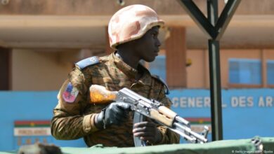 A military personnel stands outside the headquarters of the country's defence forces in Ouagadougou on March 3, 2018 a day after dozens of people were killed in twin attacks on the French embassy and the country's military.