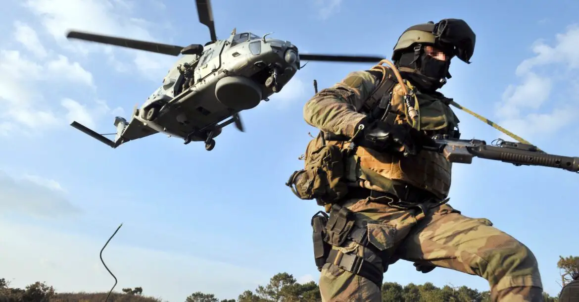 A soldier of French Jaubert naval commando pictured after getting off a NH90 “Caiman” helicopter during an exercise