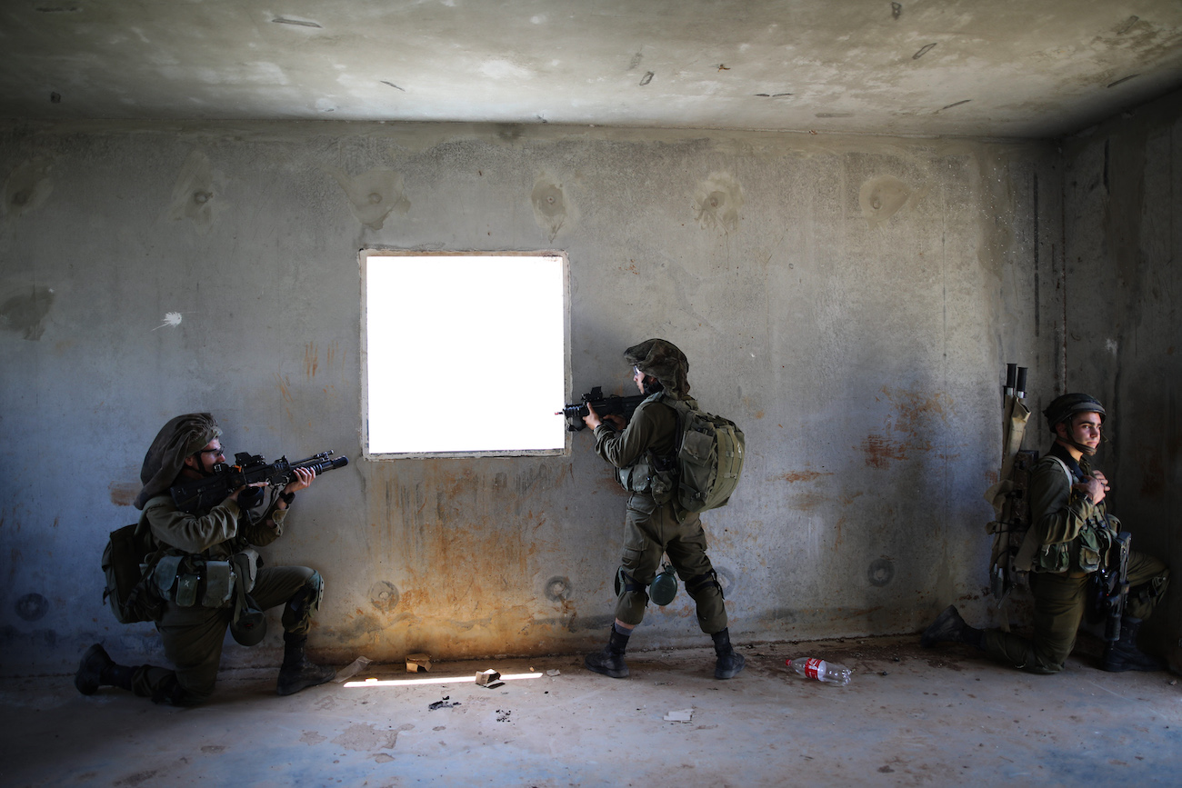 Israeli soldiers of the Golani Brigade take part in an urban warfare drill at a mock village in the Elyakim army base, Northern Israel, May 16, 2017.