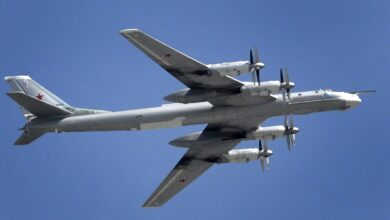 A Russian Tupolev Tu-95 turboprop-powered strategic bomber flies above the Kremlin in Moscow, on May 7, 2015, during a rehearsal for the Victory Day military parade.