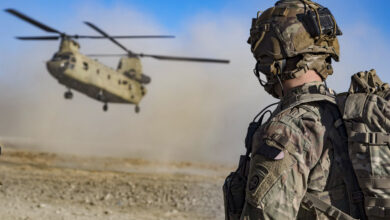 Army Staff Sgt. Jason N. Bobo watches as a CH-47 Chinook prepares to land to provide transport for US and Afghan soldiers after a key leader engagement in southeastern Afghanistan, December 29, 2019