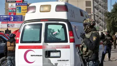 Iraqi security forces at the scene of Thursday's twin suicide bombing.