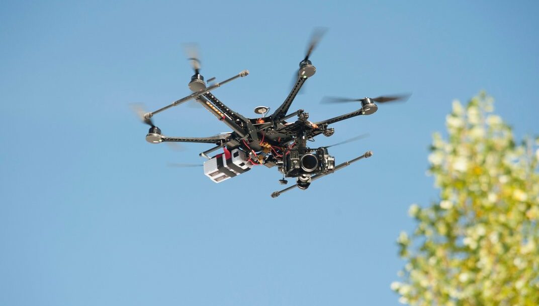 Photo of a small drone hovering.
