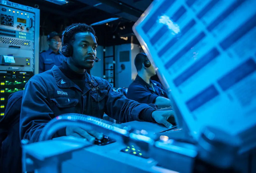 Sonar Technician (Surface) 2nd Class Dontreal Brown, from Leesburg, Fla., stands watch as an acoustic sensor operator during an anti-submarine warfare exercise in the sonar control room aboard the Arleigh Burke-class guided-missile destroyer USS Milius (DDG 69) during Annual Exercise (ANNUALEX) 19