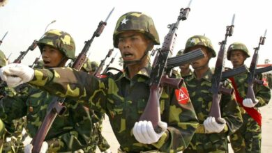 Myanmar soldiers seen marching in formation.