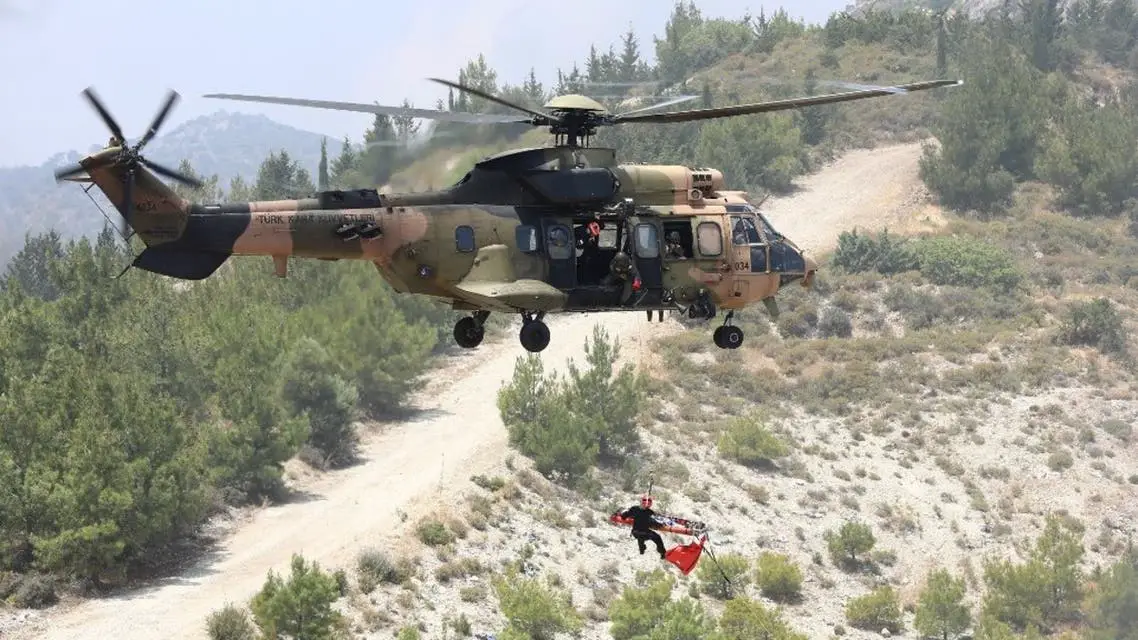 A Turkish army's Eurocopter AS532 Cougar helicopter takes part in a military rescue mission exercise in the northern part of the Mediterranean island of Cyprus in the self-proclaimed Turkish Republic of Northern Cyprus, on June 11, 2019