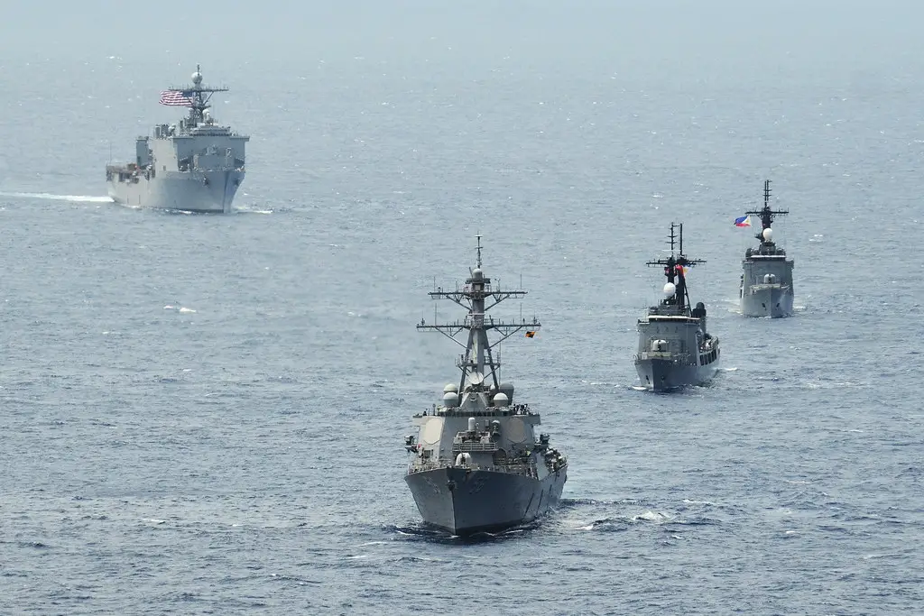 The Arleigh Burke-class destroyer USS John S. McCain (DDG 56), the Philippine navy frigate BRP Gregaorio del Pilar (PF-15), the Philippine navy frigate BRP Ramon Alcaraz (PF-16) and the Whidbey Island-class amphibious dock landing ship USS Ashland (LSD 48) steam in formation during Cooperation Afloat Readiness and Training (CARAT) Philippines 2014.