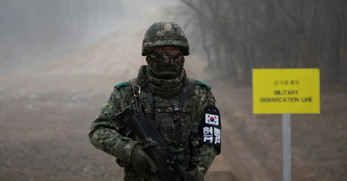 A South Korean soldier stands before the military demarcation line separating North and South Korea