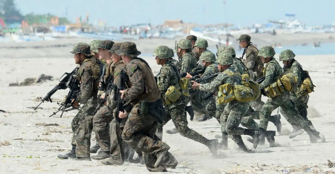 The Philippine and US Marines taking positions during a beach assault exercise facing the South China Sea in San Antonio, Zambales province on May 9, 2014