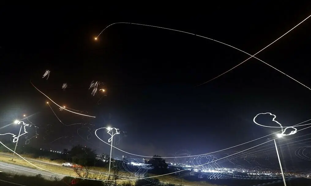 Israel's Iron Dome aerial defense system intercepts rockets launched from the Gaza Strip, controlled by the Palestinian Islamist movement Hamas, above the southern Israeli city of Ashkelon, on May 10, 2021