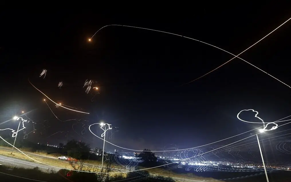 Israel's Iron Dome aerial defense system intercepts rockets launched from the Gaza Strip, controlled by the Palestinian Islamist movement Hamas, above the southern Israeli city of Ashkelon, on May 10, 2021
