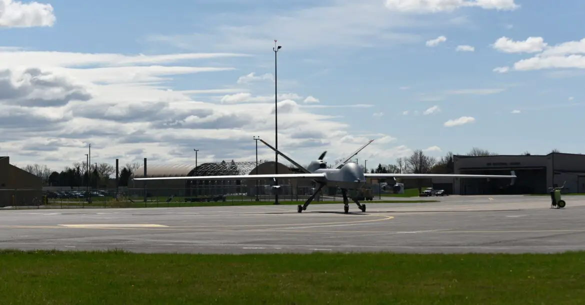 An MQ-9 Reaper with three Ghost Reaper pods attached awaits takeoff at Hancock Field Air National Guard Base, Syracuse, New York.