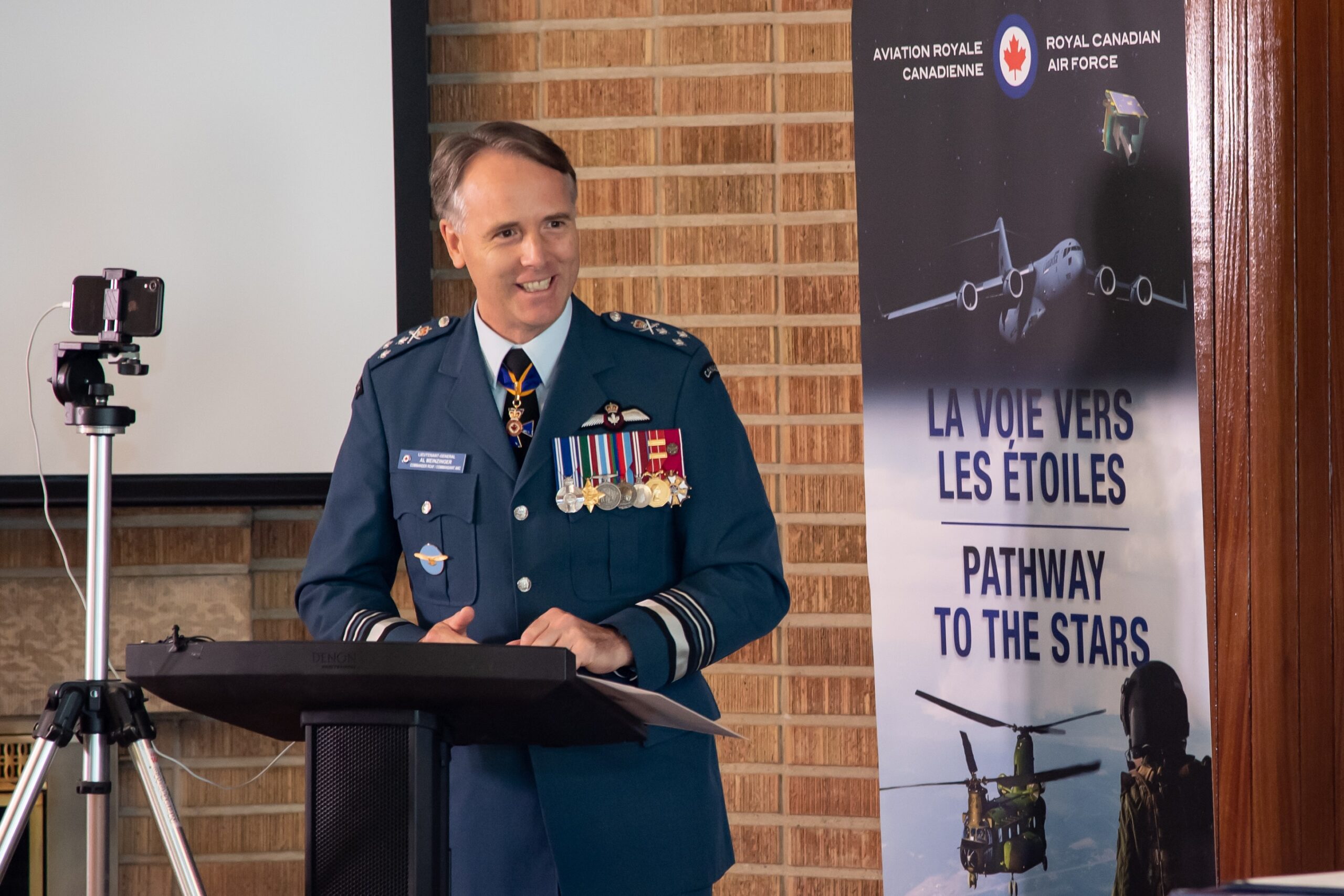 canada air force commander al meinzinger standing during a speech