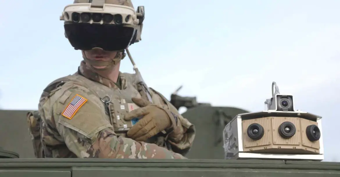 A soldier dons the Integrated Visual Augmentation System Capability Set 3 hardware while mounted on a Stryker at Joint Base Lewis-McCord, Washington, in January 2021