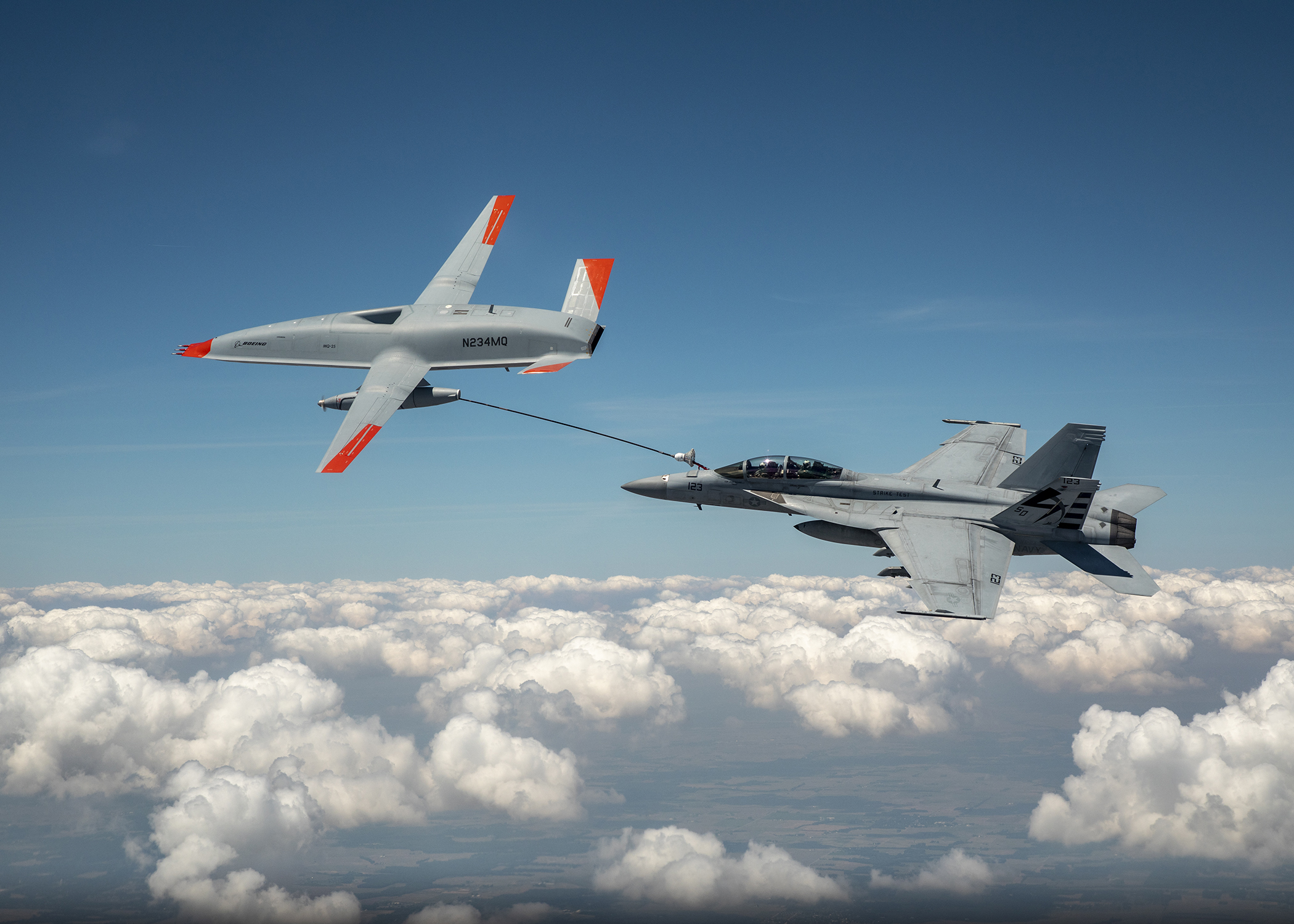 The Boeing MQ-25 T1 test asset transfers fuel to a US Navy F/A-18 Super Hornet on June 4, marking the first time in history that an unmanned aircraft has refueled another aircraft.