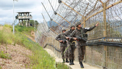 South Korean soldiers patrol along the line through the Demilitarized Zone in Hwacheon County