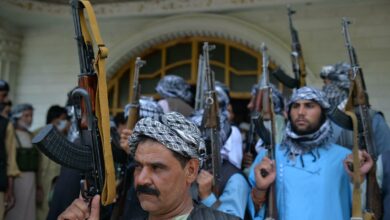 Afghan militia gather with their weapons to support Afghanistan security forces against the Taliban