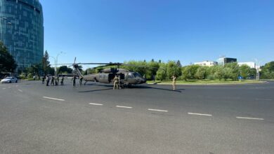 A military Black Hawk helicopter made an emergency landing in busy boulevard in the Charles de Gaulle Square in northern Bucharest on Thursday July 15, 2021 morning, stopping traffic and knocking down two light poles but no injuries were reported