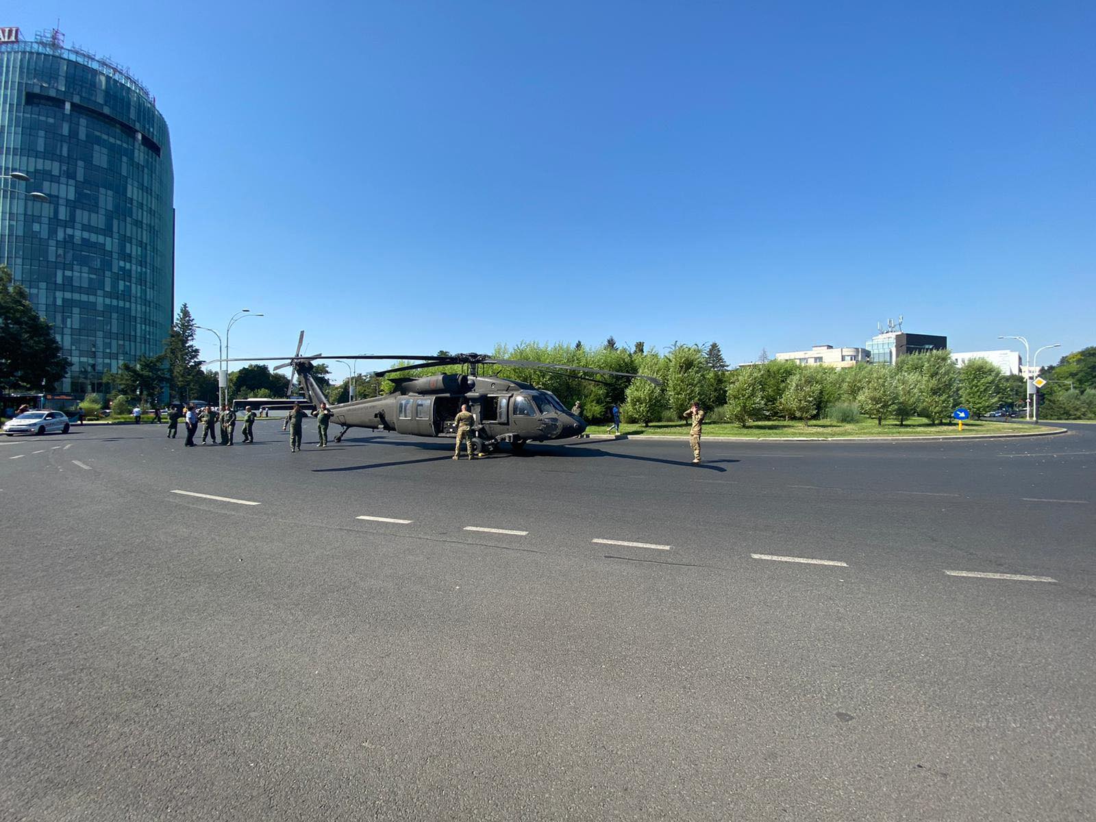 A military Black Hawk helicopter made an emergency landing in busy boulevard in the Charles de Gaulle Square in northern Bucharest on Thursday July 15, 2021 morning, stopping traffic and knocking down two light poles but no injuries were reported