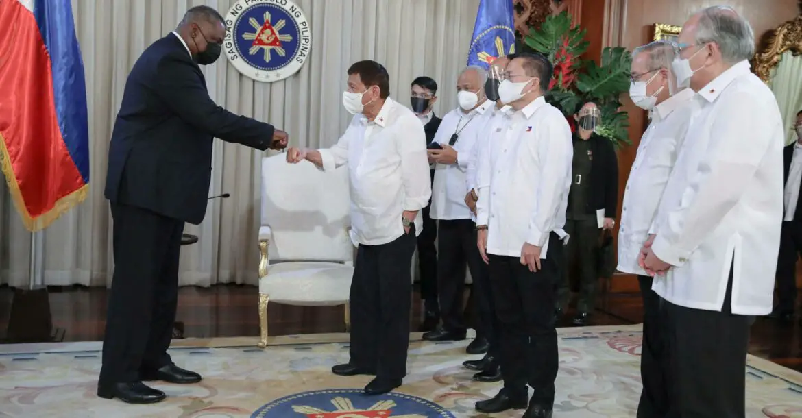 Philippine President Rodrigo Duterte greeting US Secretary of Defense Lloyd Austin during a courtesy call at Malacanang Palace in Manila