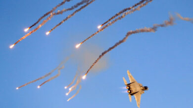 An Israeli F-15 I fighter jet launches anti-missile flares during an air show near the southern Israeli city of Beer Sheva