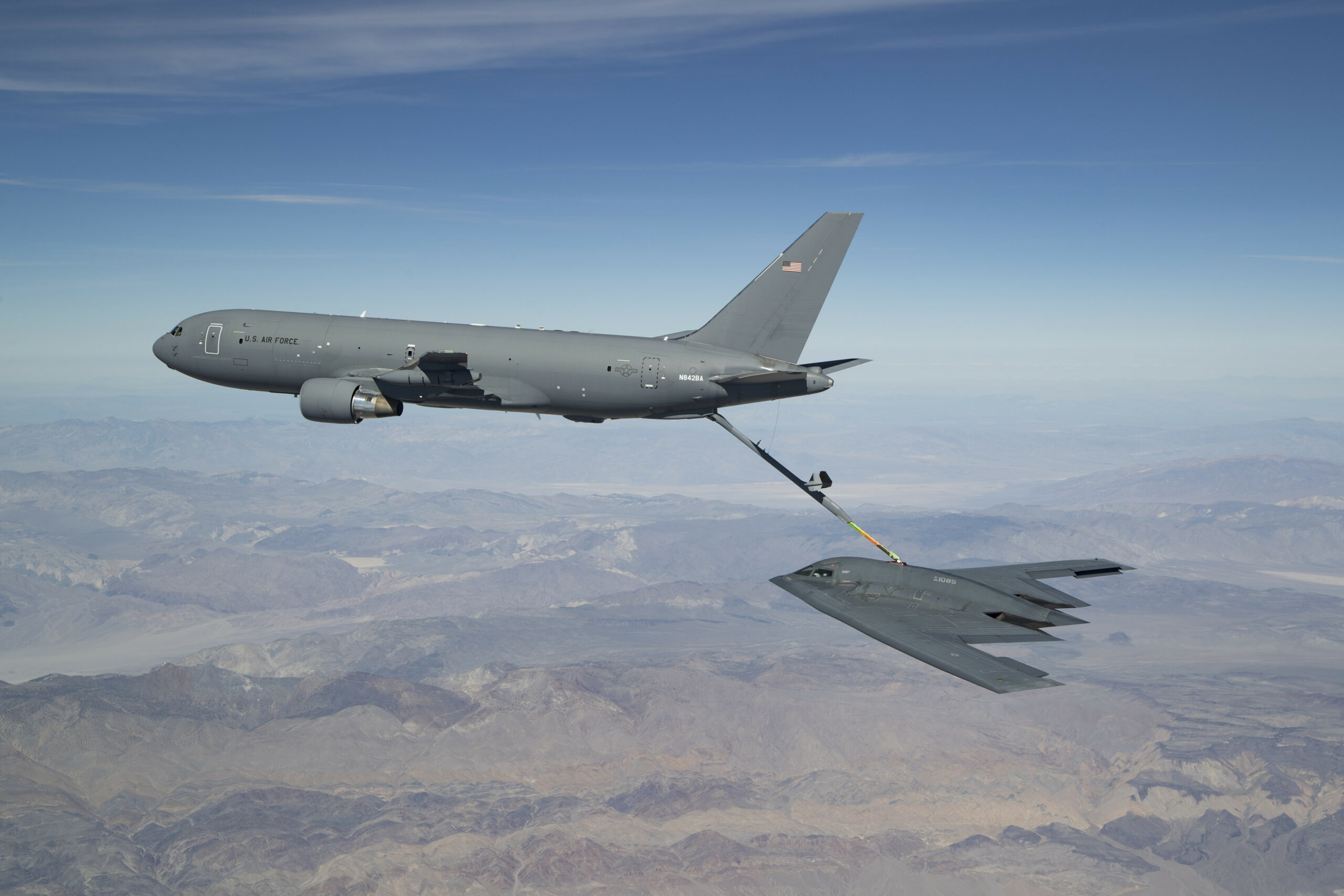 A KC-46 refuels the B-2 for the first time during developmental flight test over Edwards AFB and the Sierra Nevada Mountains in April 2019.