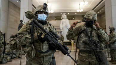 Virginia National Guard Soldiers prepare their gear for after resting in the Visitor Center in the US Capitol in Washington, DC, January 2021