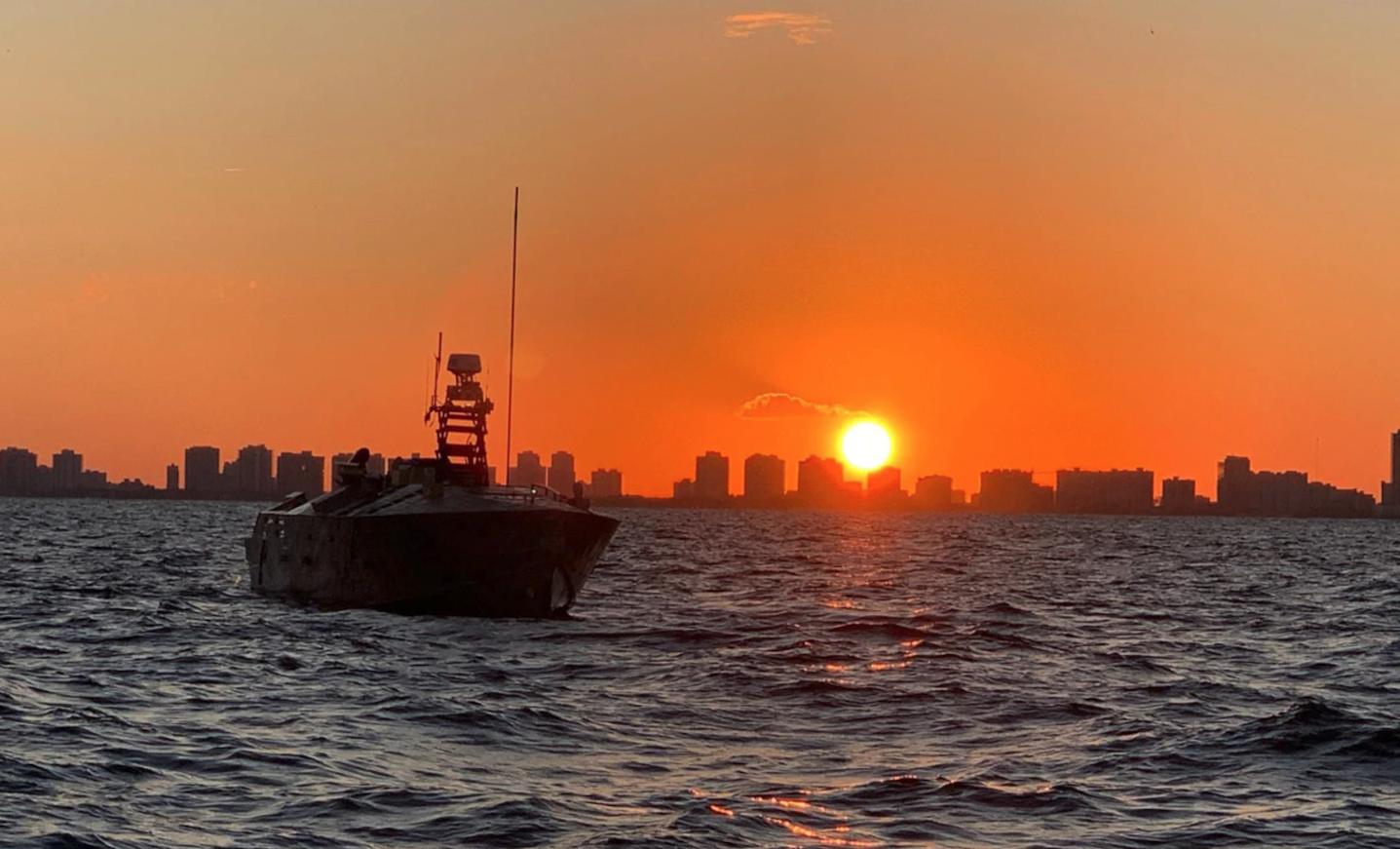 The Unmanned Influence Sweep System (UISS) heads offshore at sunrise for an Operational Assessment mission off the coast of South Florida in November 2019