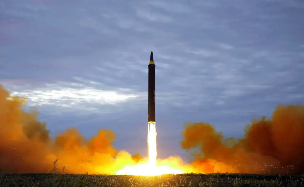 An intermediate-range strategic ballistic rocket Hwasong-12 lifting off from the launching pad