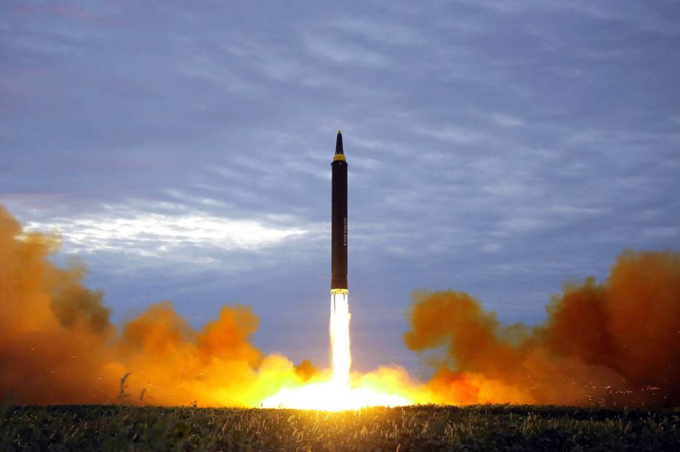 An intermediate-range strategic ballistic rocket Hwasong-12 lifting off from the launching pad