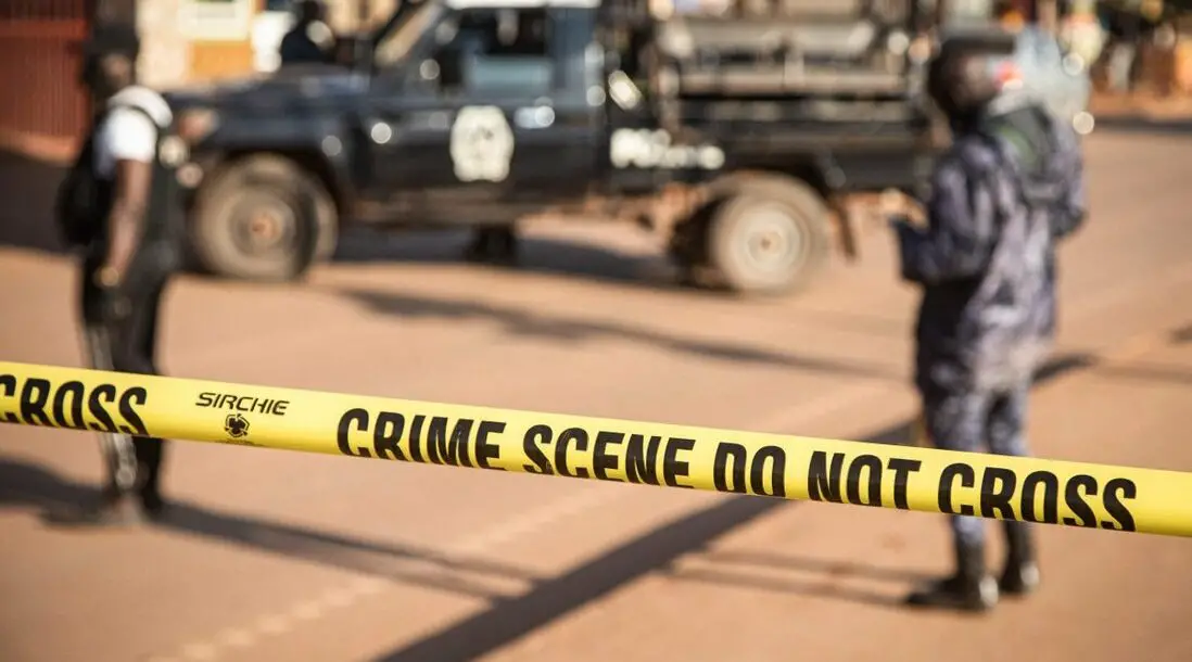 Ugandan police secure the crime scene on Sunday following a bomb blast in capital Kampala