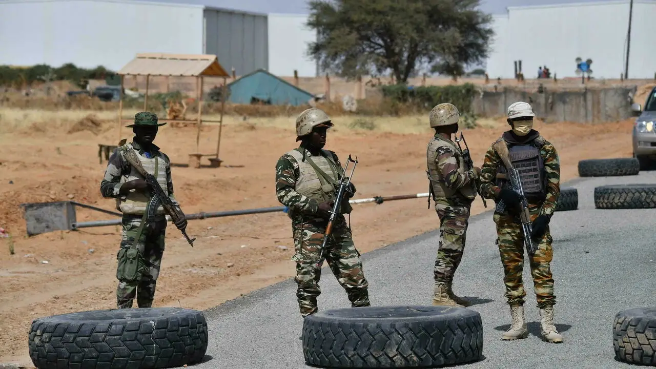 Nigerien soldiers stand guard outside Diffa airport