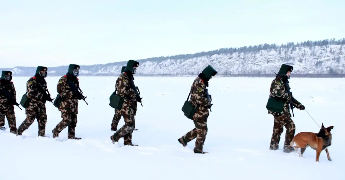 https://www.thedefensepost.com/wp-content/uploads/2021/11/Chinese-soldiers-snow-1170x610.png