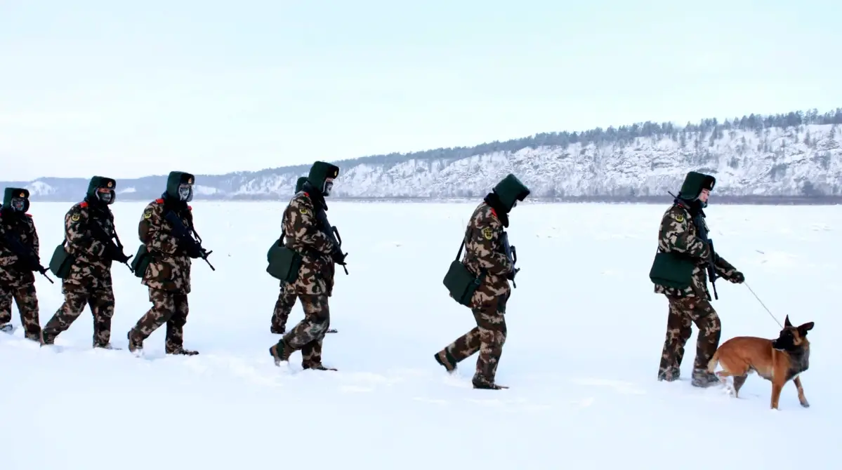 Chinese paramilitary police border guards train in the snow at Mohe County in China's northeast Heilongjiang province, on the border with Russia, December 2016