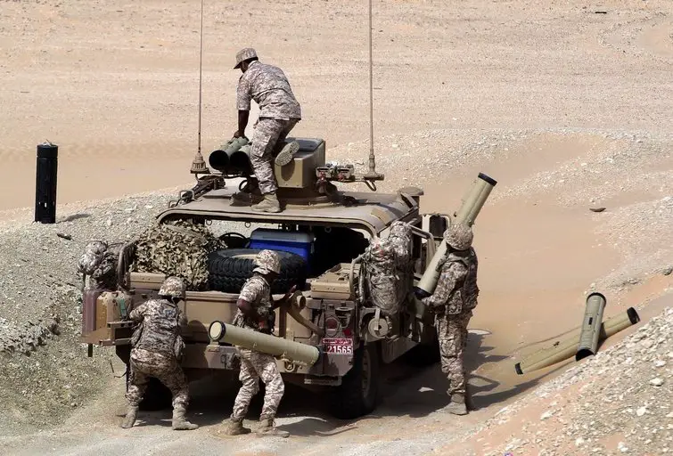 UAE soldiers load their military vehicle with rockets during manoeuvres with the French army in the desert of Abu Dhabi