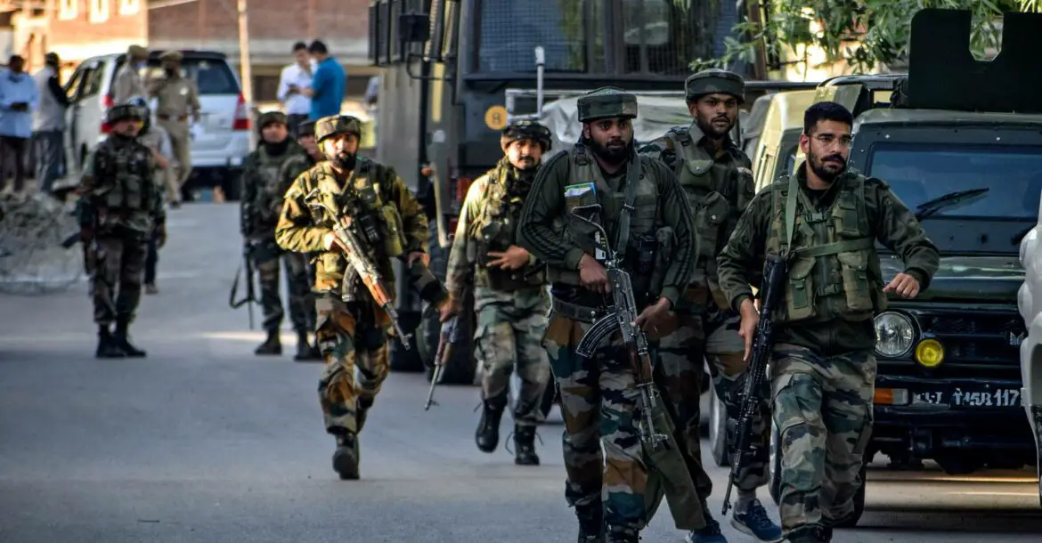 Security personnel arrive near the scene of a militant attack at Pandach Chowk