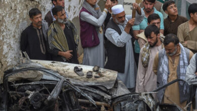 Afghan residents and family members of the victims gather at the site of deadly US drone attack in Kabul