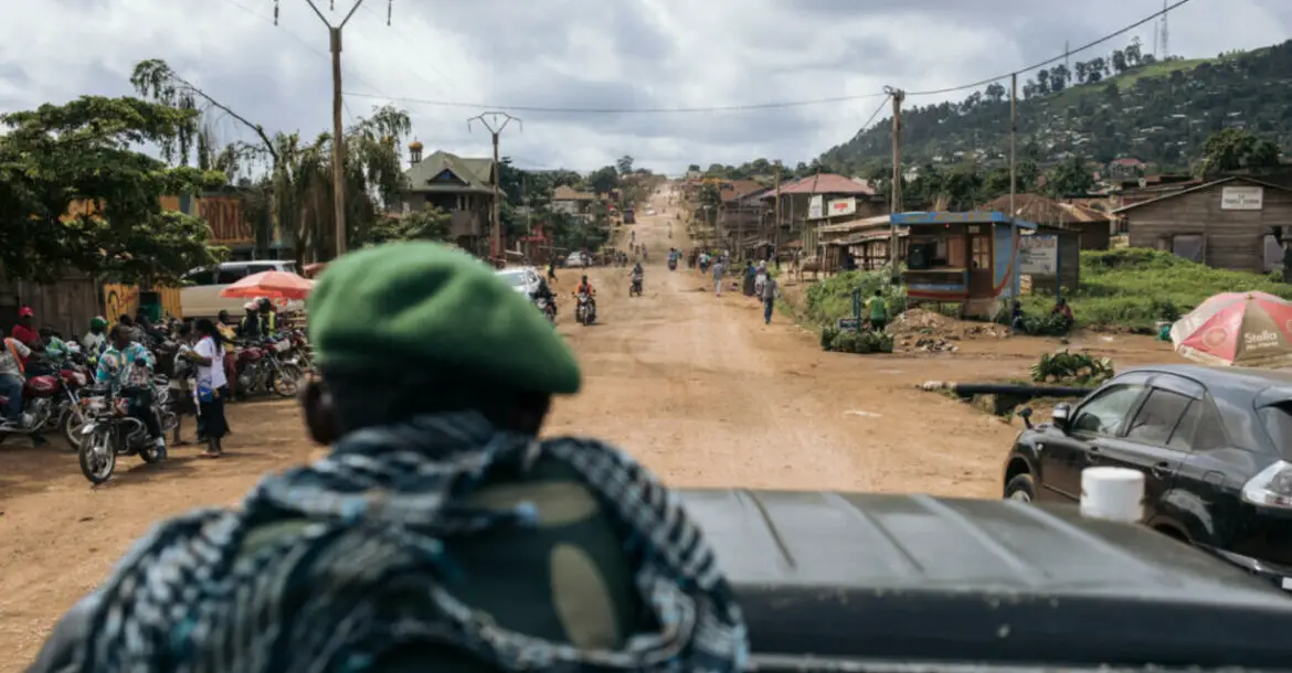 Congolese soldiers drive along the road