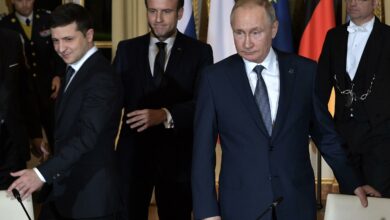 Ukrainian President Volodymyr Zelenskiy, French President Emmanuel Macron and Russian President Vladimir Putin arrive for a meeting on Ukraine with German Chancellor at the Elysee Palace