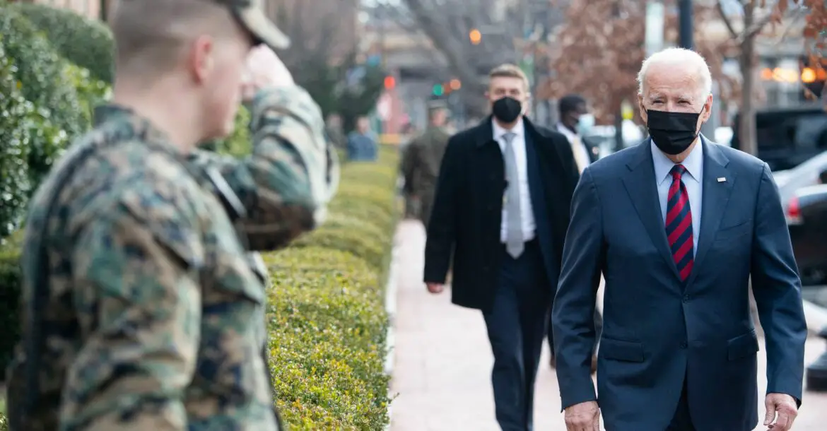 President Biden greets US Marines outside the Marine Barracks in Washington, DC