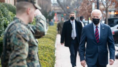 President Biden greets US Marines outside the Marine Barracks in Washington, DC
