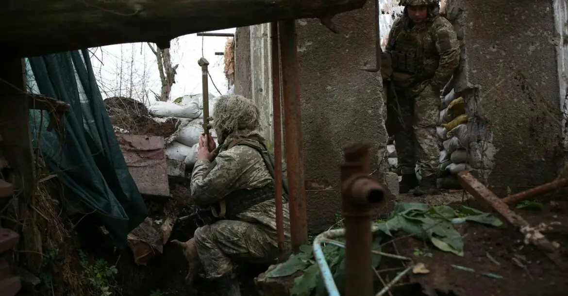 Ukrainian soldiers keep watch on the frontline with Russia-backed separatists