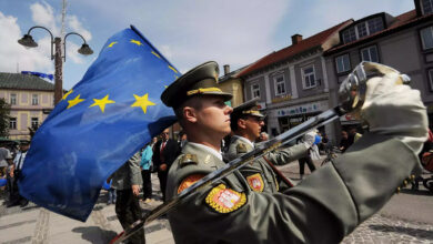 Slovakian soldiers march with the EU flag