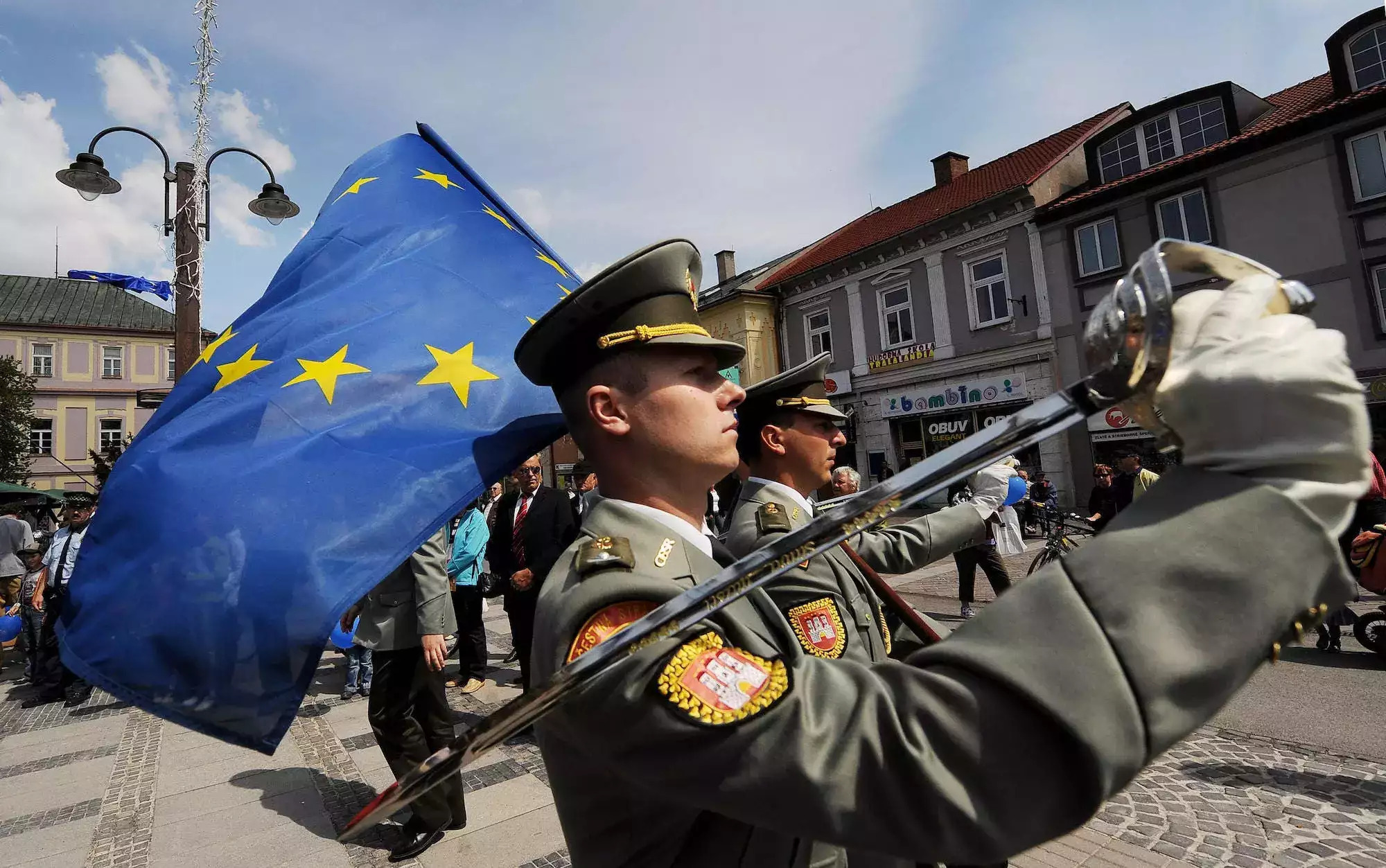 Slovakian soldiers march with the EU flag