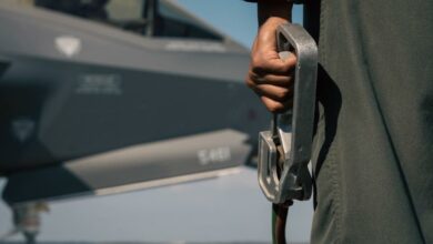 US Marine holding a dead man’s switch during hot-pit refueling training