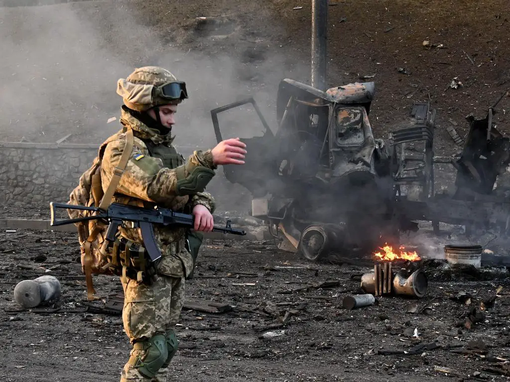 Ukrainian service member seen at the site of fighting with a Russian raiding group