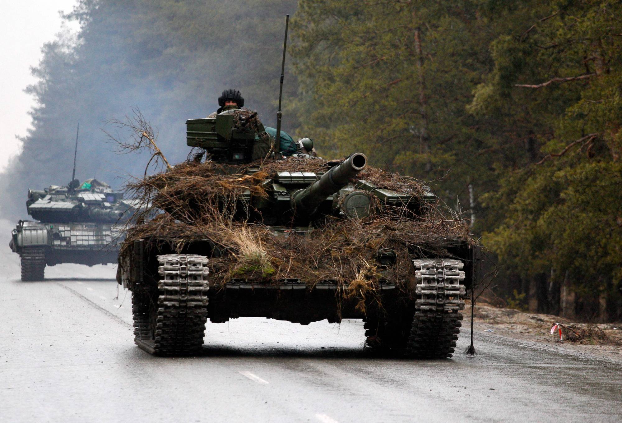 Ukrainian tanks move on a road