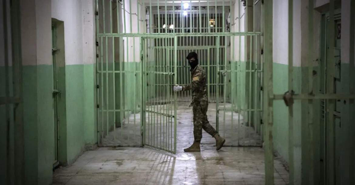 A member of the Syrian Democratic Forces serving guard in a prison in al-Hasakah province in northeastern Syria