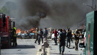 Security forces arrive at the site of a car bomb attack in Kabul