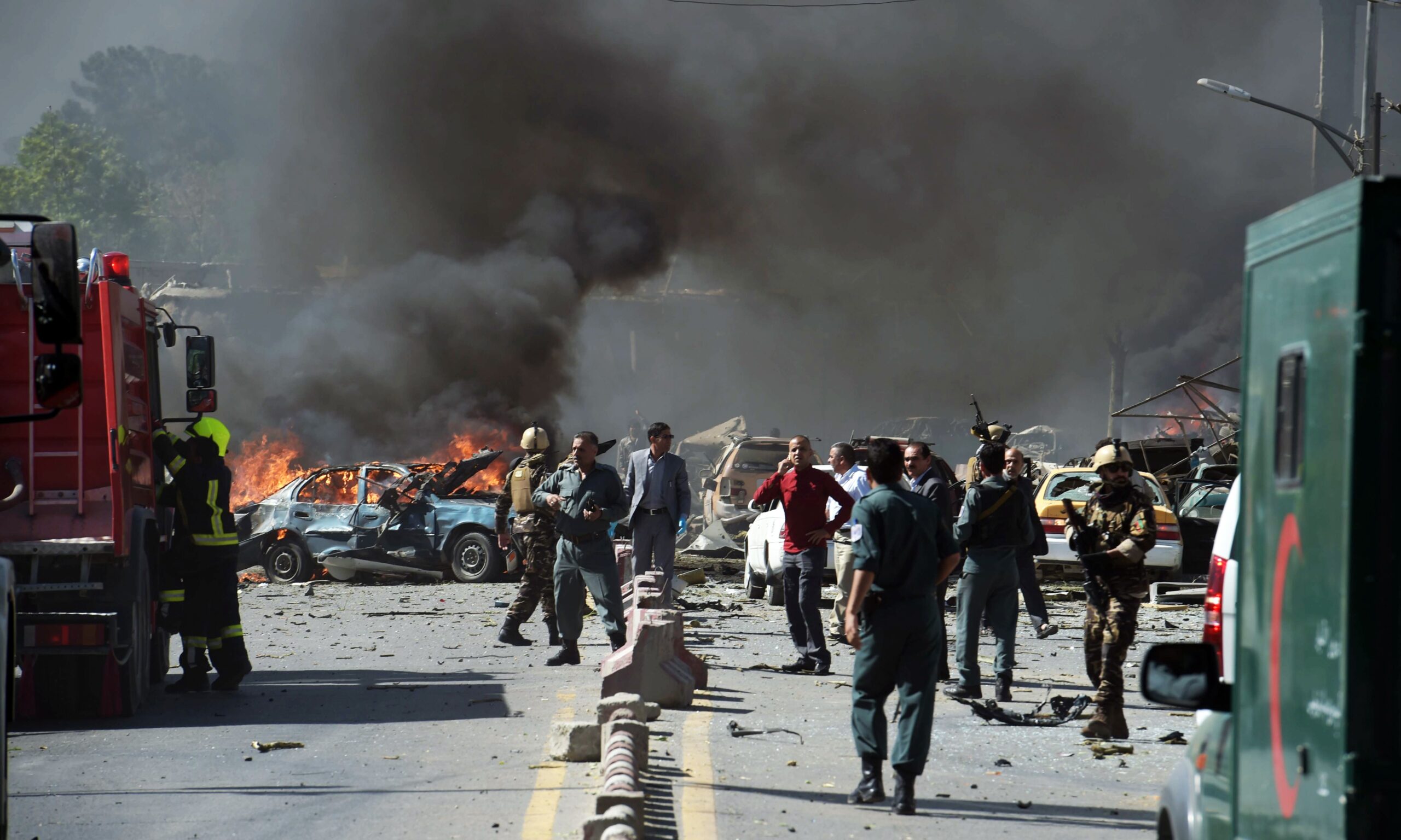 Security forces arrive at the site of a car bomb attack in Kabul